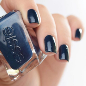 Model showing off navy blue manicure.